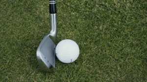 golf iron with a ball