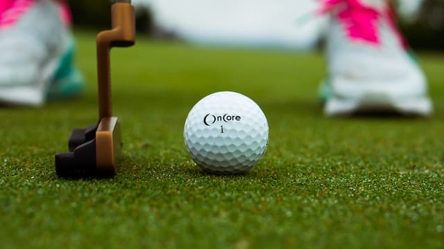Golf ball with putter
